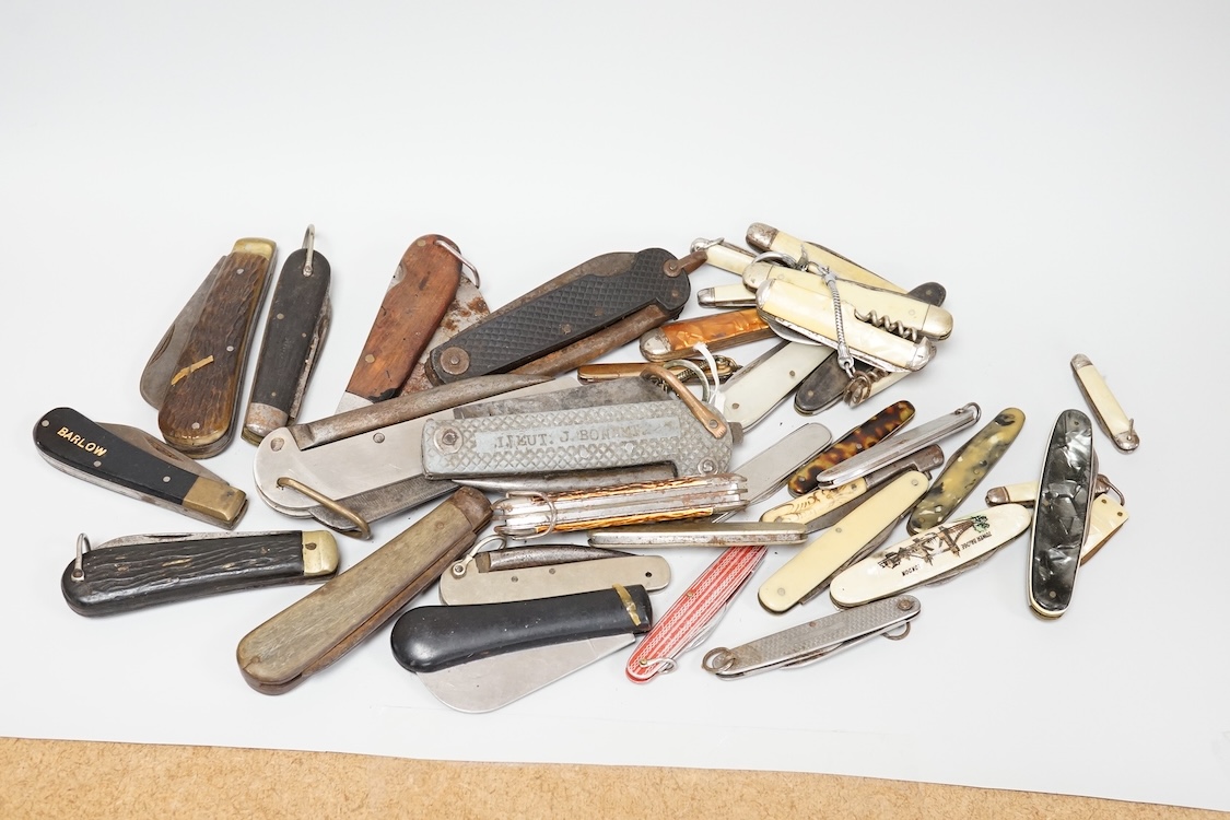 A collection of assorted penknives and whistles